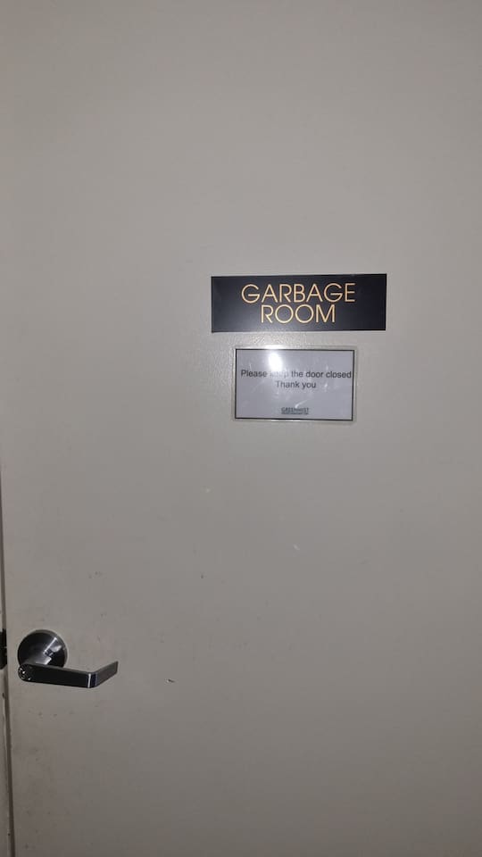 Garbage room is facing unit 23.